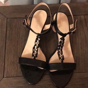 Nine West black strap heels with gold ring accent